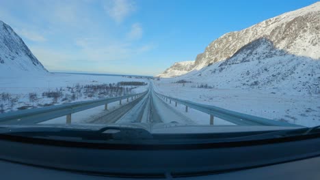 revealing unstad in northern norway from car driving in lofoten, windshield view, pov car view slow motion 60p