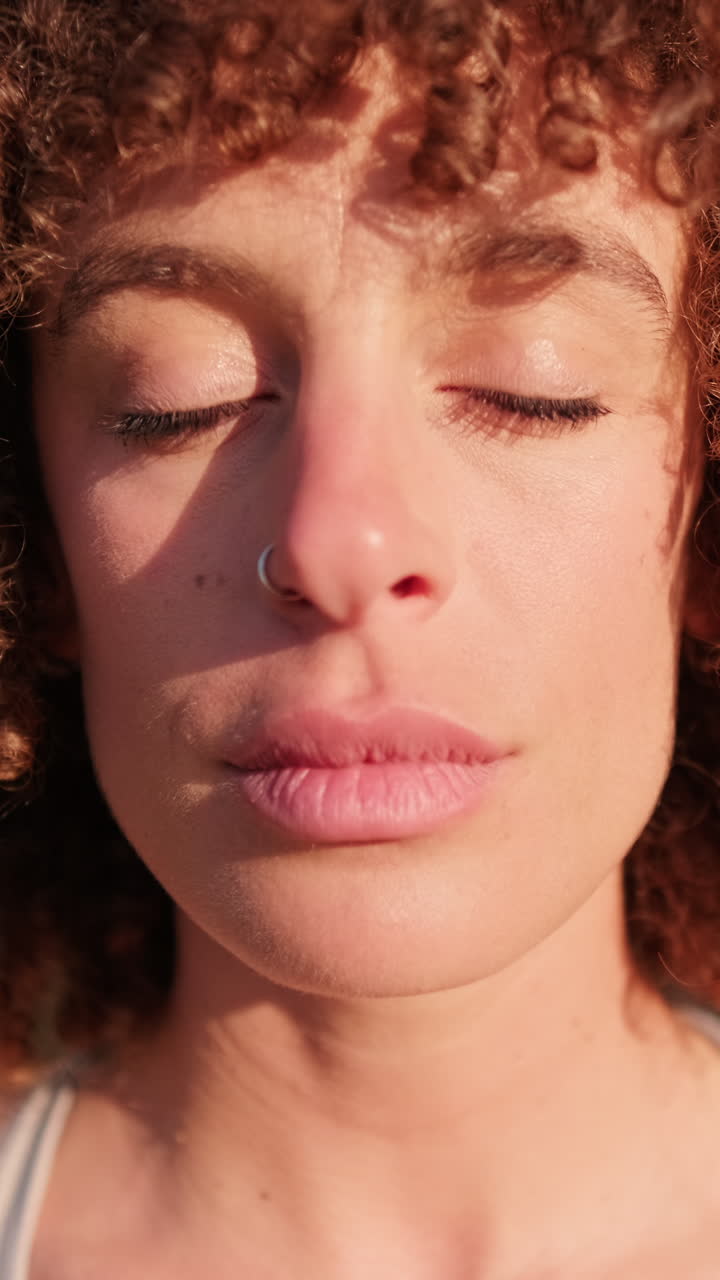 Woman Meditates Outdoors and Opens Her Eyes