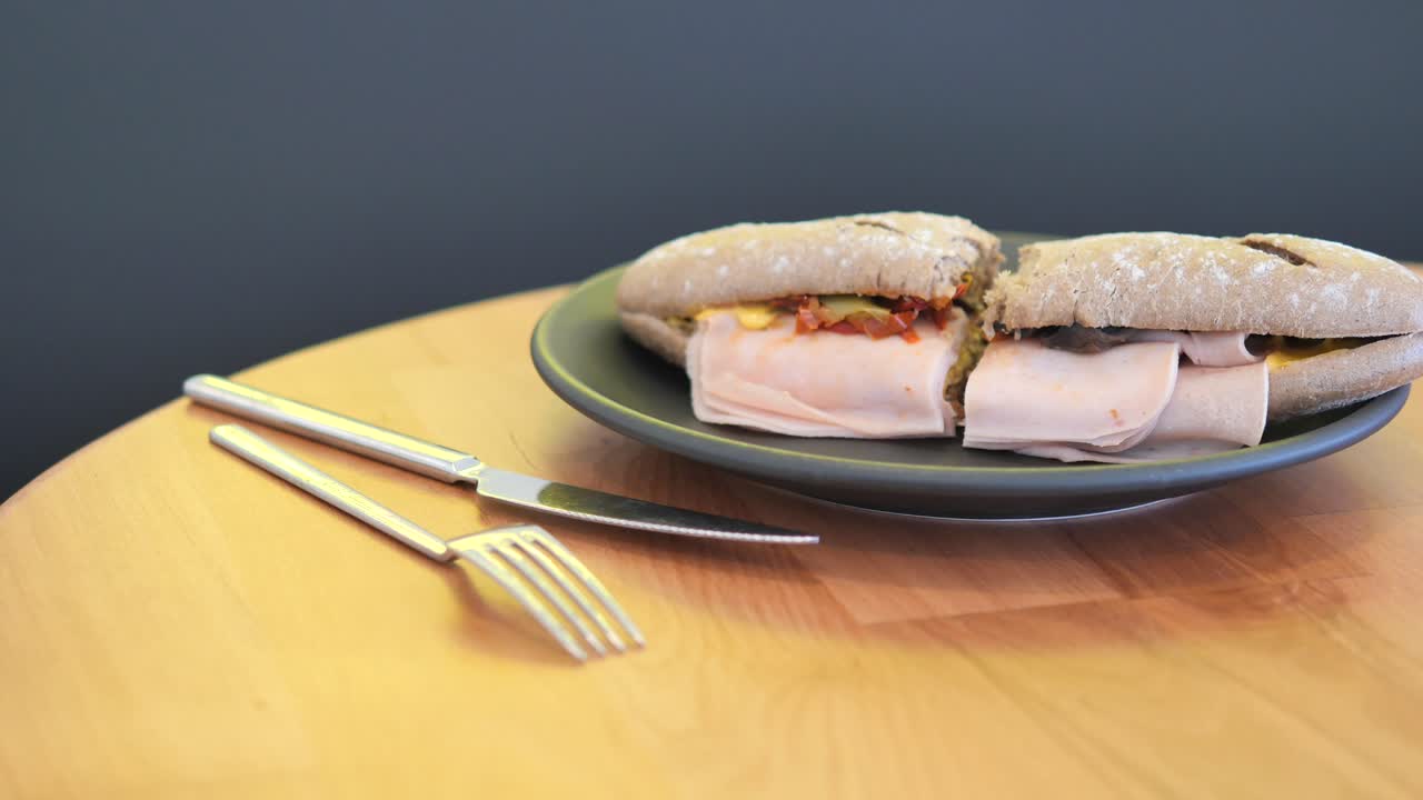 Sandwich on a Plate with Cutlery