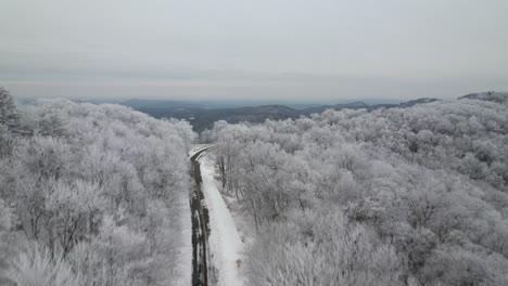 mountain-roadway-with-rime-ice-on-trees-near-blowing-rock-and-boone-nc,-north-carolina-aerial