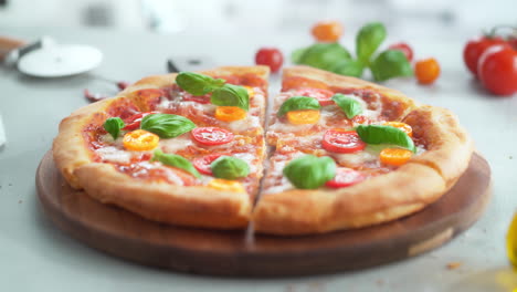 pizza margherita slices disappearing from a wooden serving board - table top view, stop motion