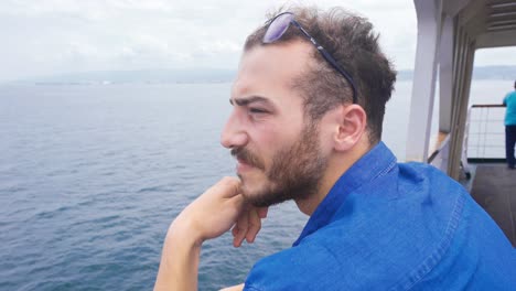 thoughtful man is cruising on the ship.