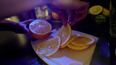 bartender cutting an orange