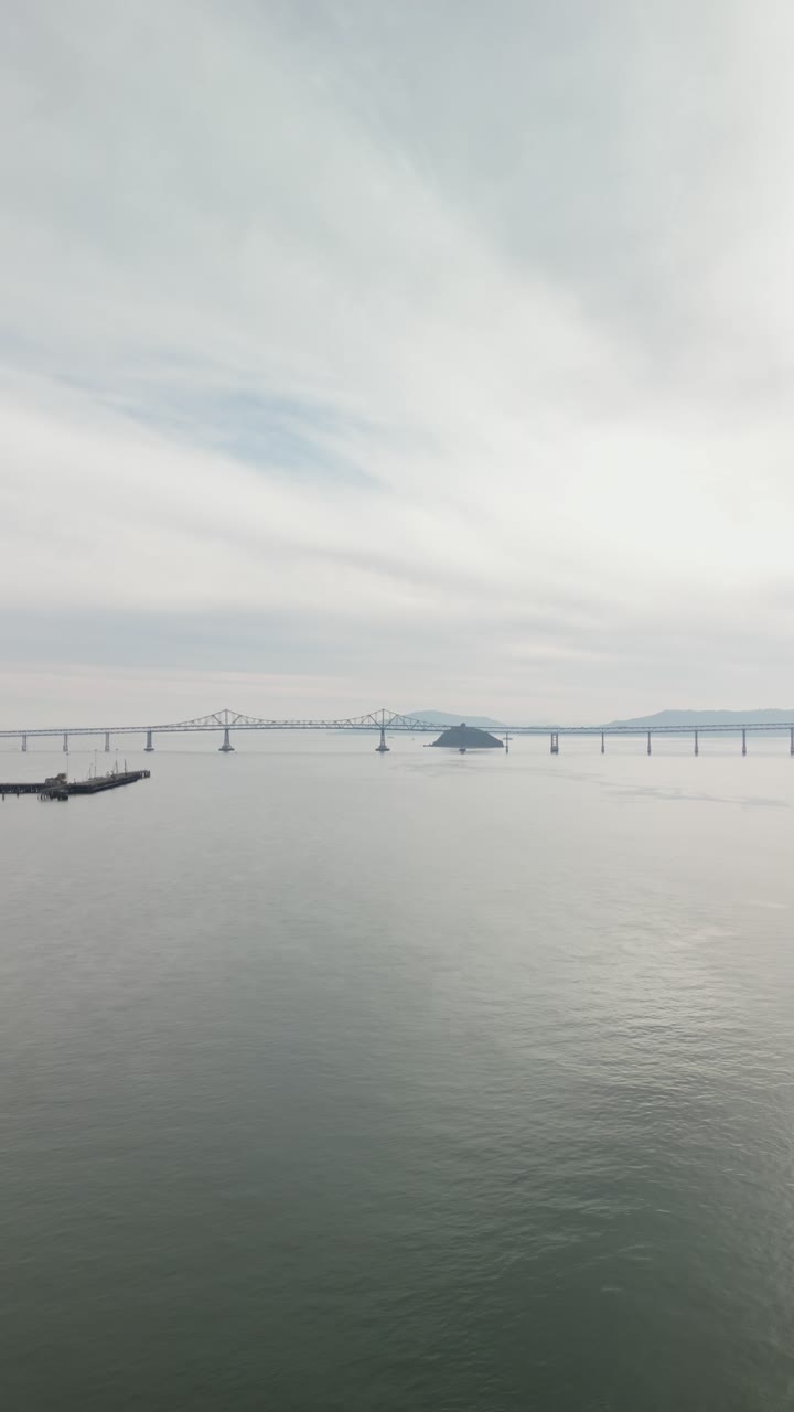 An aerial perspective reveals the Richmond-San Mateo Bridge's sleek design cutting through the bay.