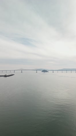 An aerial perspective reveals the Richmond-San Mateo Bridge's sleek design cutting through the bay.