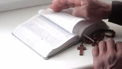 praying-to-god-with-hands-together-with-bible-and-cross-black-man-praying-with-black-background-stock-video-stock-footage