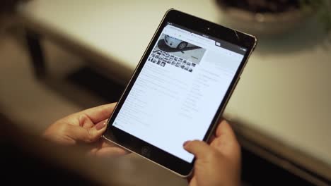 Woman-looking-at-a-car-for-sale-on-iPad