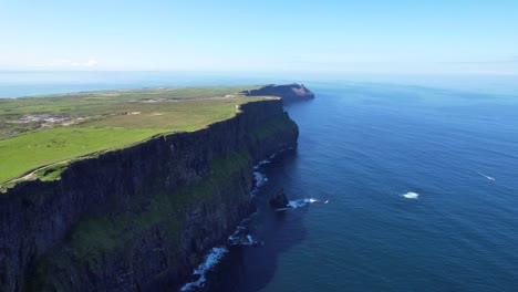 Sky-high-aerial-view-over-Cliffs-of-Moher-with-scenic-landscape