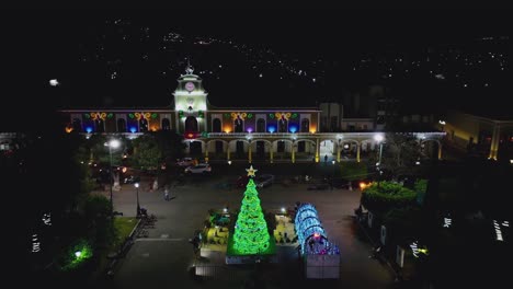 exterior facade of the city hall of ciudad guzman with colorful christmas ornaments at night in jalisco, mexico