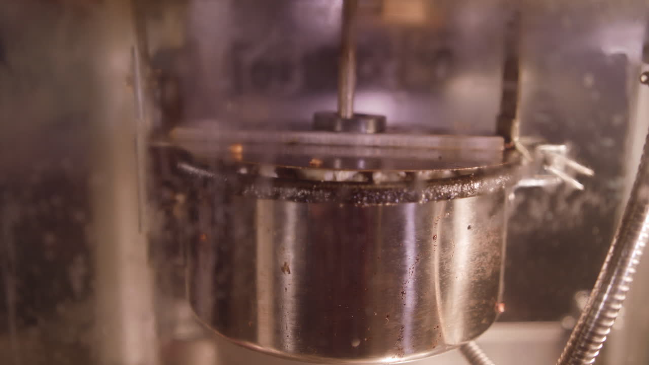 Pop Corn Being Made, popping and Over Flowing the Pan in Slow Motion