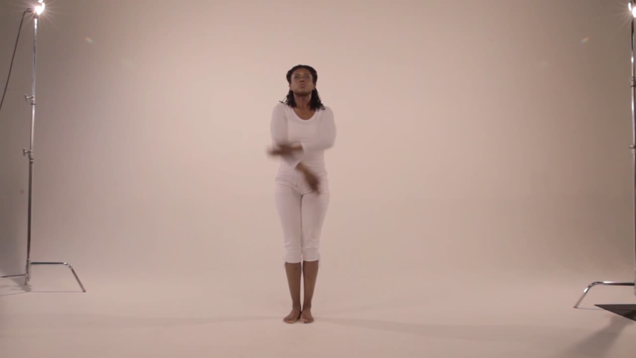 Black yogini in eagle pose