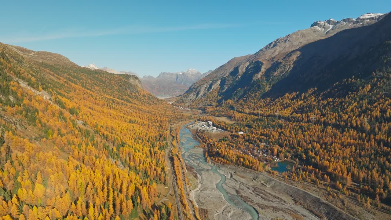 Glacier river Ova da Bernina running through autumn colored valley in Alps