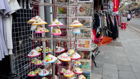 colorful hats displayed in a bustling street market