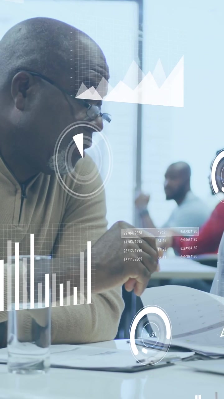 Animation of statistical data processing against diverse man and woman discussing at office