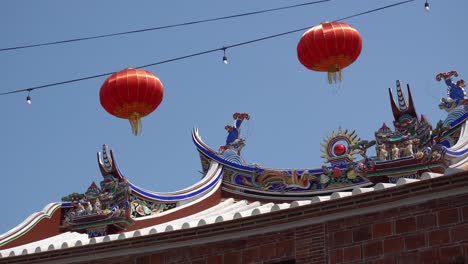 red lantern hang near the temple