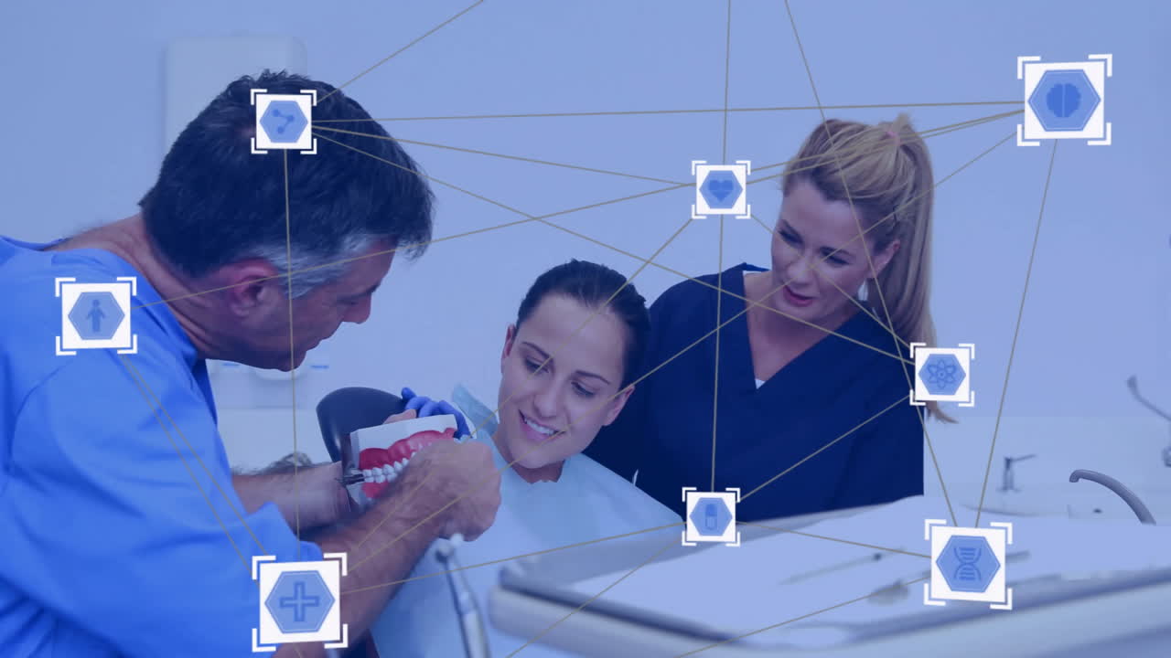 Medical network connections animation over dental professionals treating patient