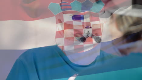 animación de la bandera de croacia ondeando sobre los cirujanos en el quirófano
