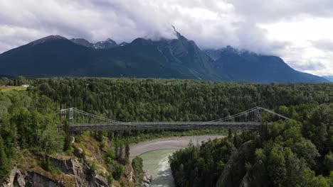 cinematic 4k aerial footage of hagwilget canyon bridge in northern british columbia in summer