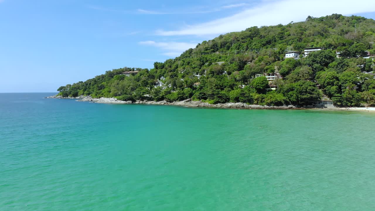 Andaman sea and tropical lush seaside hills of Phuket. Aerial forward