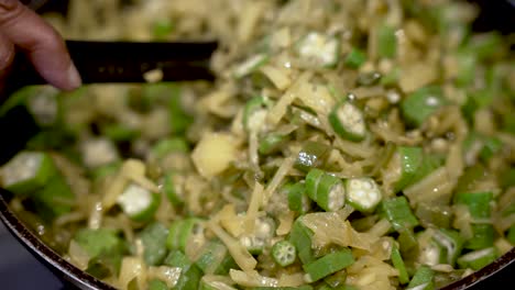 Sliced-Okra-Onions-And-Potatoes-Being-Stirred-And