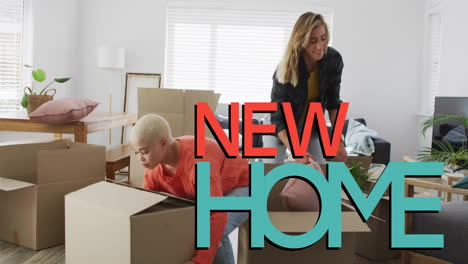 animation of new home text over gay lesbian couple unpacking boxes at home