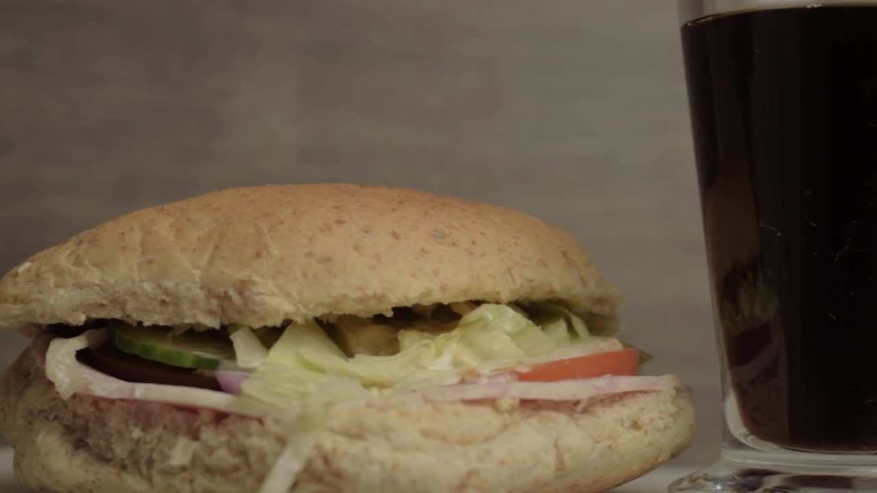 Ham salad sandwich already prepared with pot of coffee close up panning shot