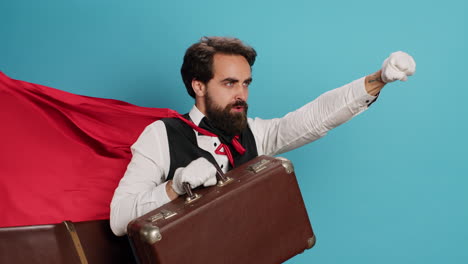 bellhop acting as superhuman with cape