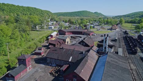 An-Aerial-View-of-an-Abandoned-Narrow-Gauge-Coal-Rail-Road-Round-House-and-Turntable-Starting-to-be-Restored