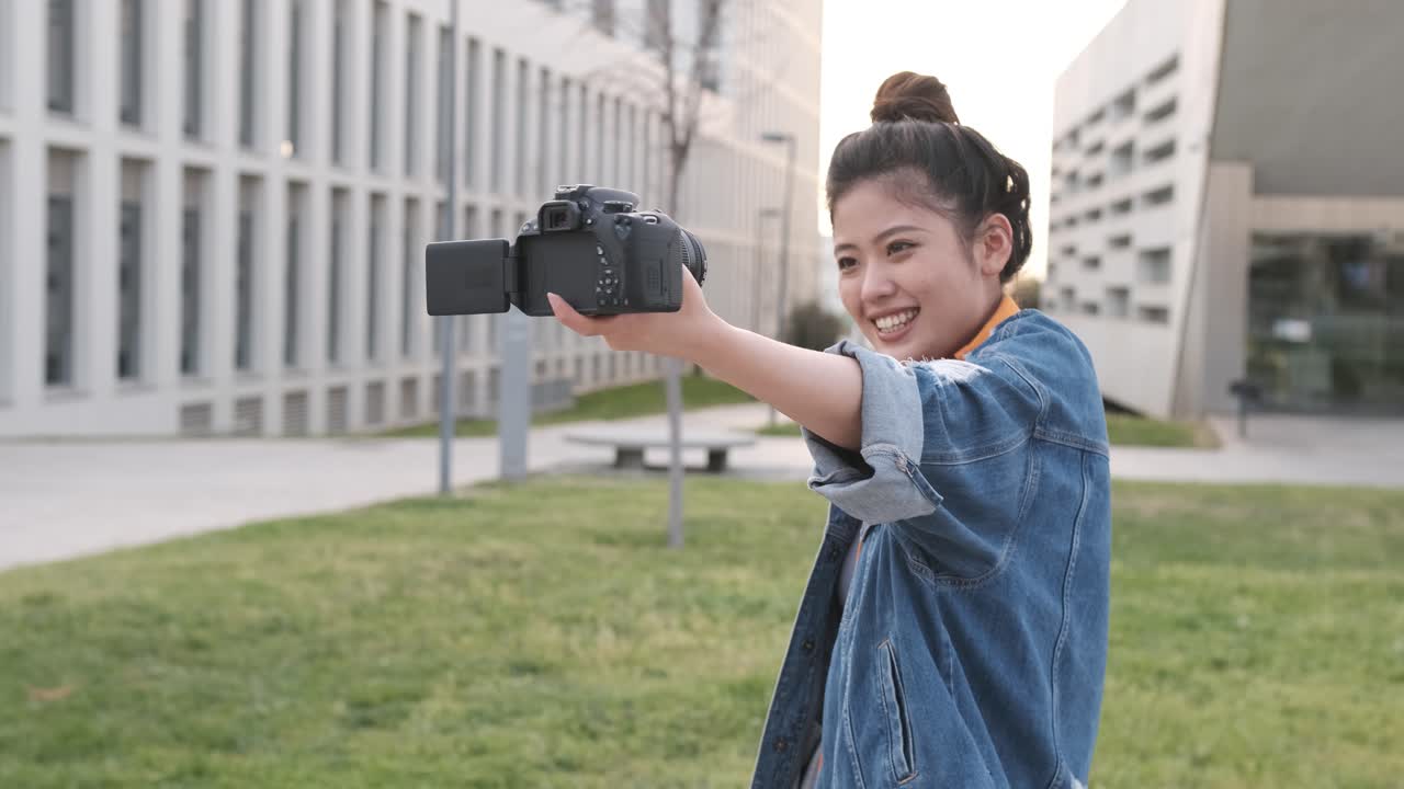 Asian woman vlogging and using camera, social media influencer content creator lifestyle