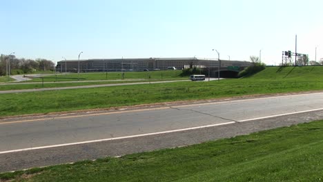 A-Tour-Bus-Travels-Down-The-Freeway-Towards-The-Pentagon-In-Washington-Dc