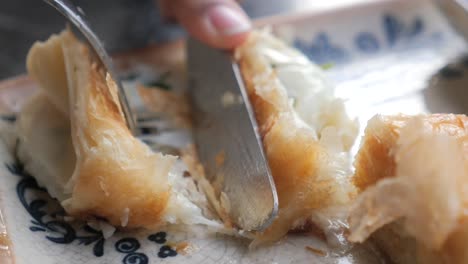 delicious pastry with fork and knife