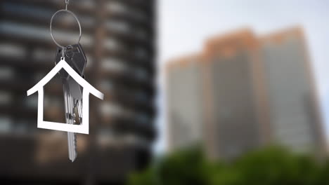 animation of silver keys and house over cityscape