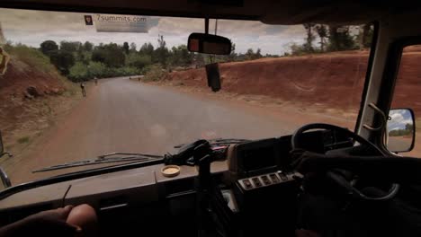 inside bus view of driver and road