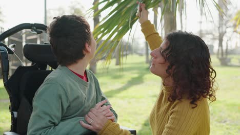 loving mother and son spending time together in the park