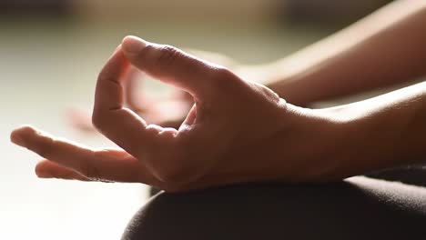 a serene moment of meditation: capturing the tranquil gesture of hand positioning in mindfulness practice for inner peace and relaxation
