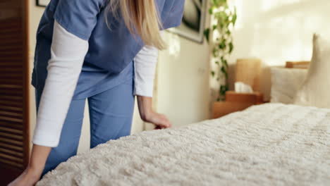 nurse making a bed