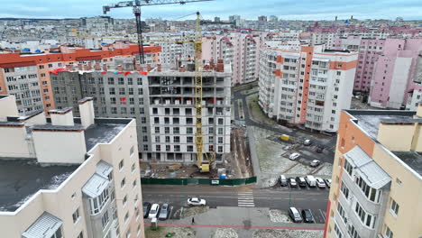 the construction of new high block of flats in the residential area. densely built new neighborhood with light apartment blocks. aerial view.