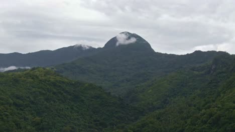 beautiful nature mountain valley landscape view under cloudy sky in puerto galera, philippines