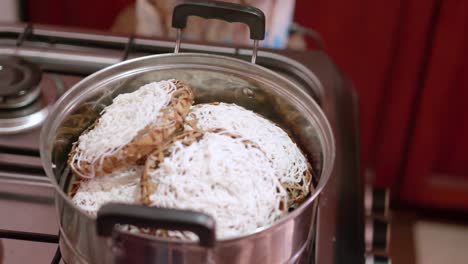 making some idiyappam, a traditional dish in sri lanka-7