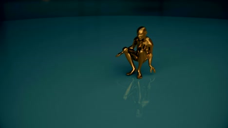 gold covered human form performs a dance then deflates.