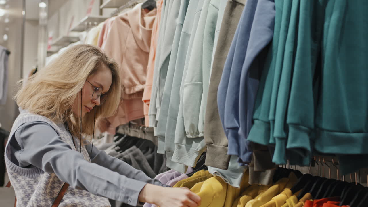 Stylish Woman Shopping At Clothing Store