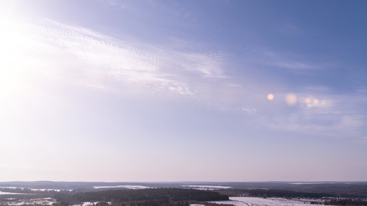 beautiful clouds fly against the backdrop of the sunny sky