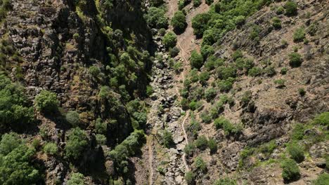 HE-SPECTACULAR-MEANCERA-WATERFALL-IN-THE-NORTH-OF-EXTREMADURA-LANDSCAPED-IN-A-NATURAL-PLACE-A-WATERFALL-100-METERS-RECORDED-WITH-MAVIC-3-IN-C4K-30FPS-AND-WITHOUT-COLOR-CORRECTION