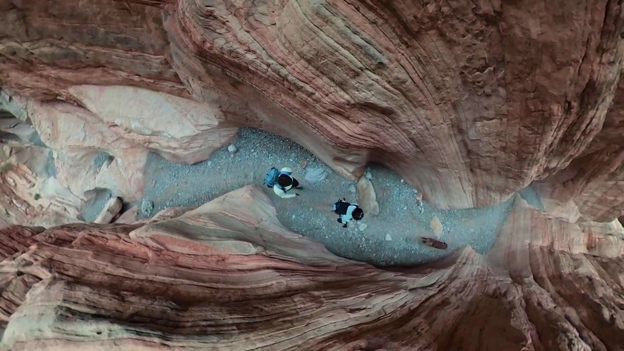 Couple With Dog Walking in Narrow Slot Canyon, Top Down 360 Degrees Camera POV