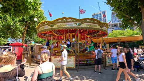 people enjoying a sunny day at funfair