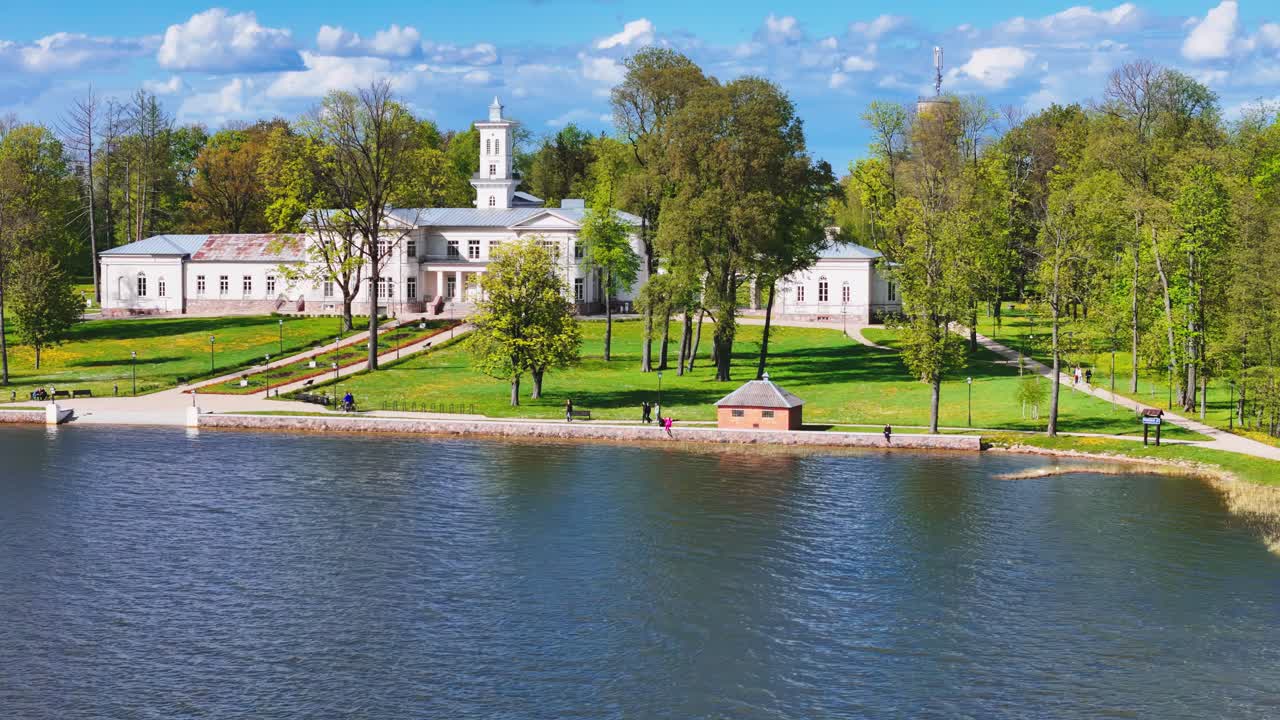 Aerial view Of Astravo dvaras (Astravas Manor) From Lake Sirvena In Birzai, Lithuania.