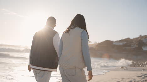 holding hands, couple and walking on sunset beach