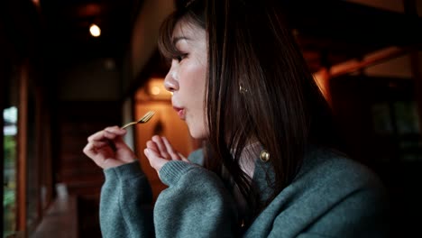 woman enjoying a meal in a traditional japanese cafe