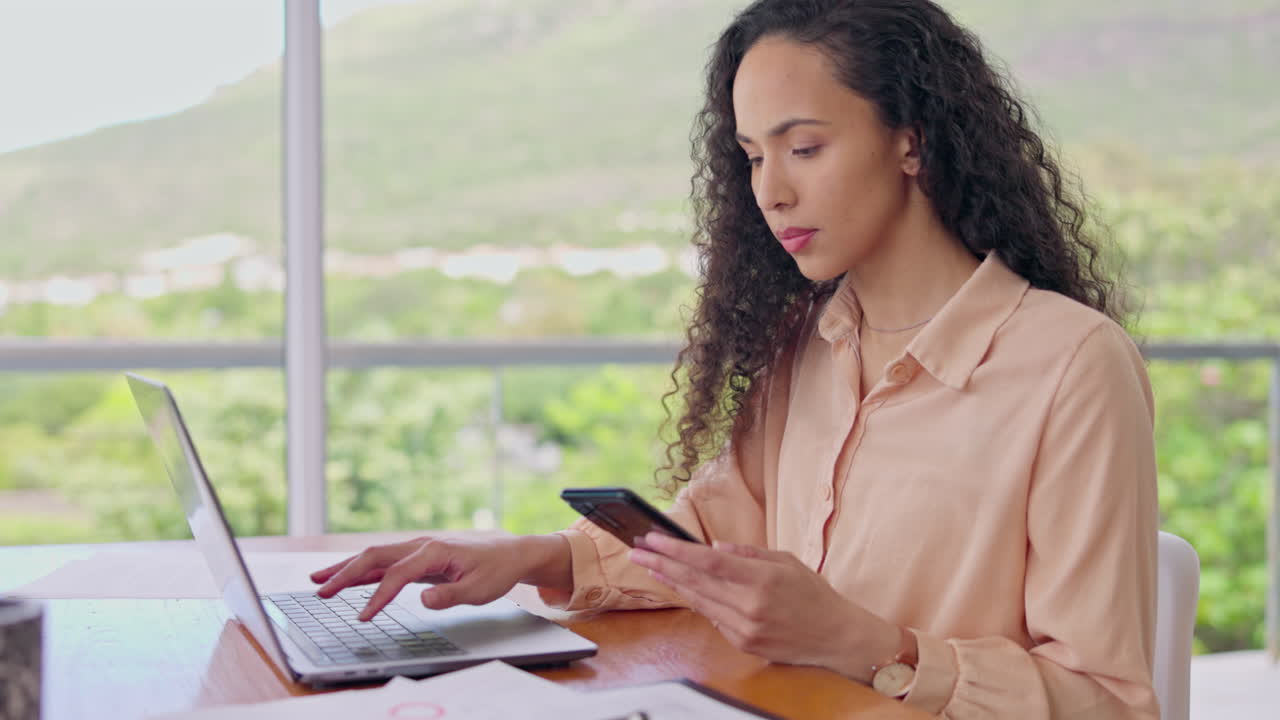 Laptop, phone and a business woman in the office