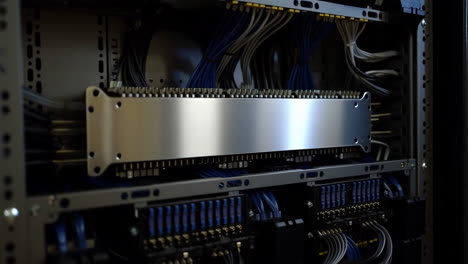 close-up of server rack with organized wiring and electronic components